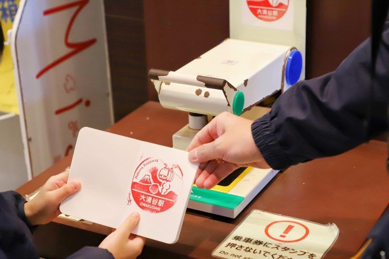 Collectible rubber ink stamp, called Eki Stamp, at Owakudani, a ropeway station at the top of mountain in Hakone, Japan.